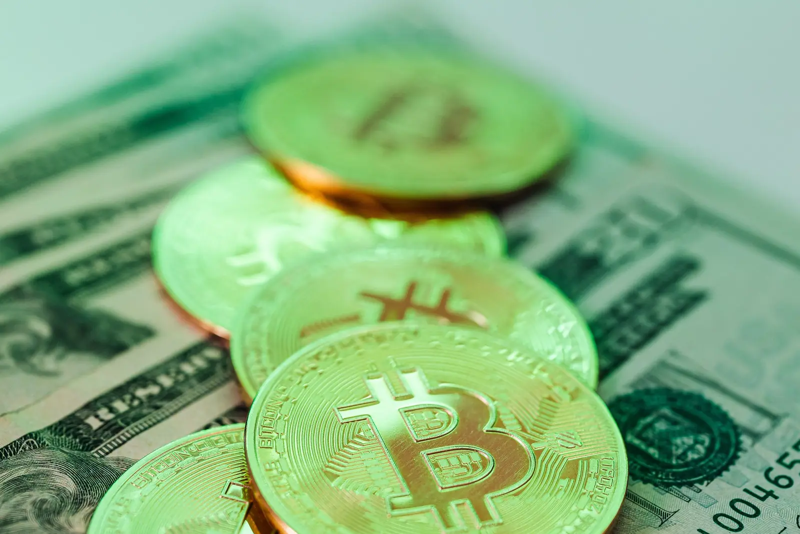 Coins on banknotes, lit green