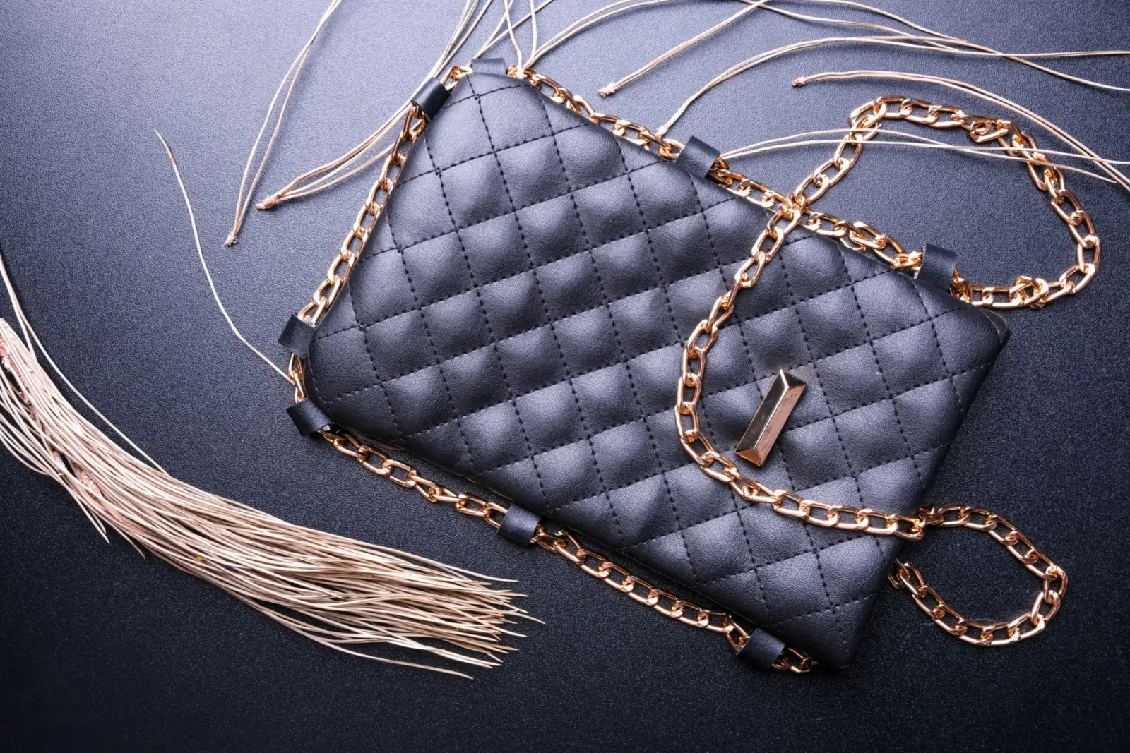 A quilted leather bag with a gold chain strap