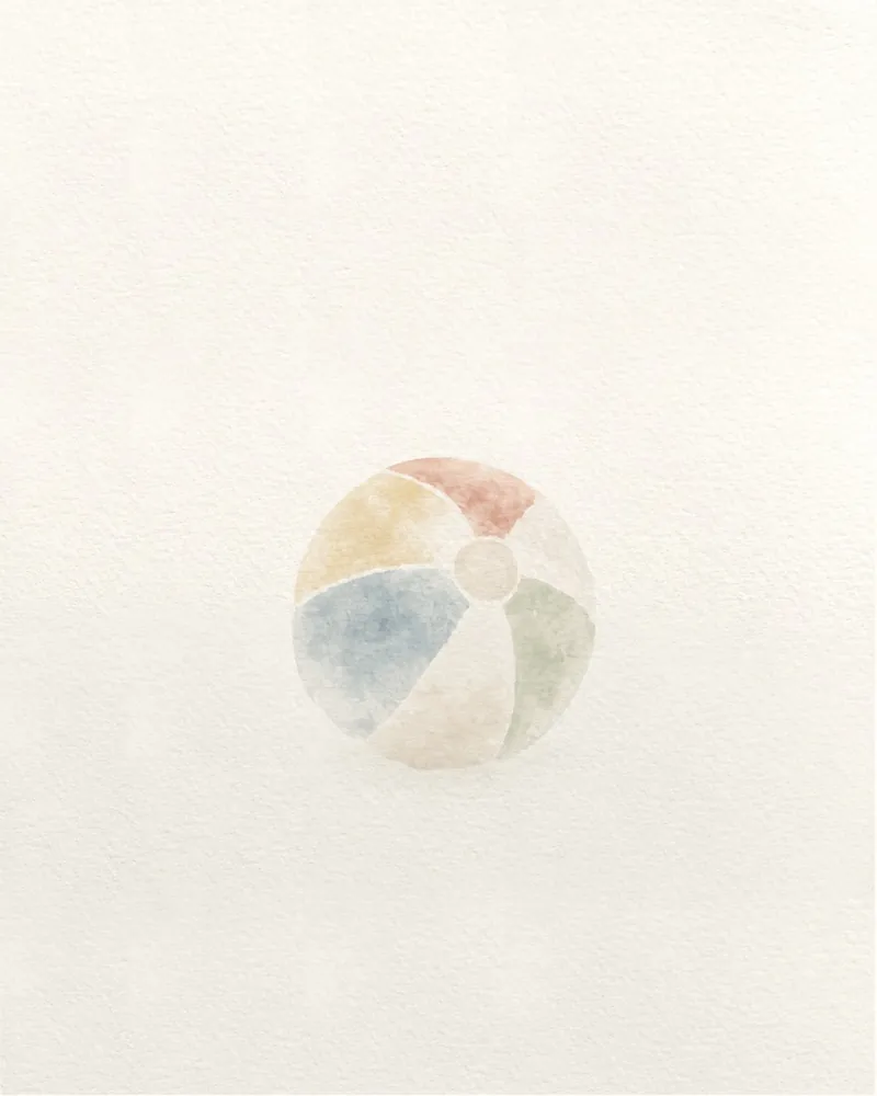 A beach ball from the generator, small and faded into the paper