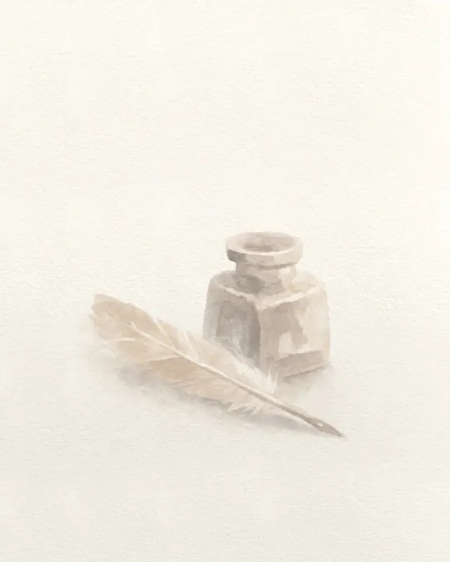 An ink bottle and a quill